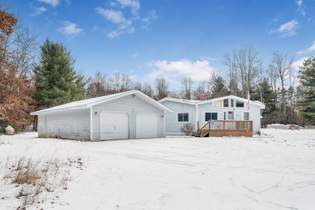 view of front facade featuring a garage and a deck