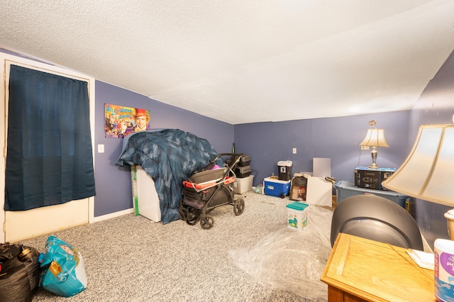 bedroom featuring carpet, a textured ceiling, and lofted ceiling