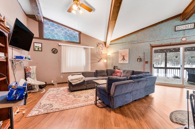 living room with beamed ceiling, ceiling fan, hardwood / wood-style floors, and high vaulted ceiling