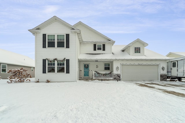 view of front of home featuring covered porch and a garage