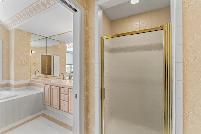 bathroom with tile patterned flooring, vanity, and an enclosed shower