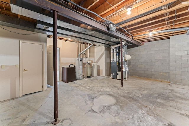 basement with water heater and heating unit