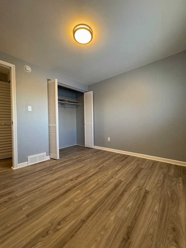 unfurnished bedroom with wood-type flooring