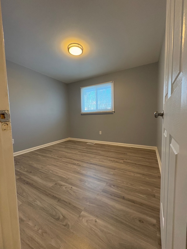 empty room featuring hardwood / wood-style floors