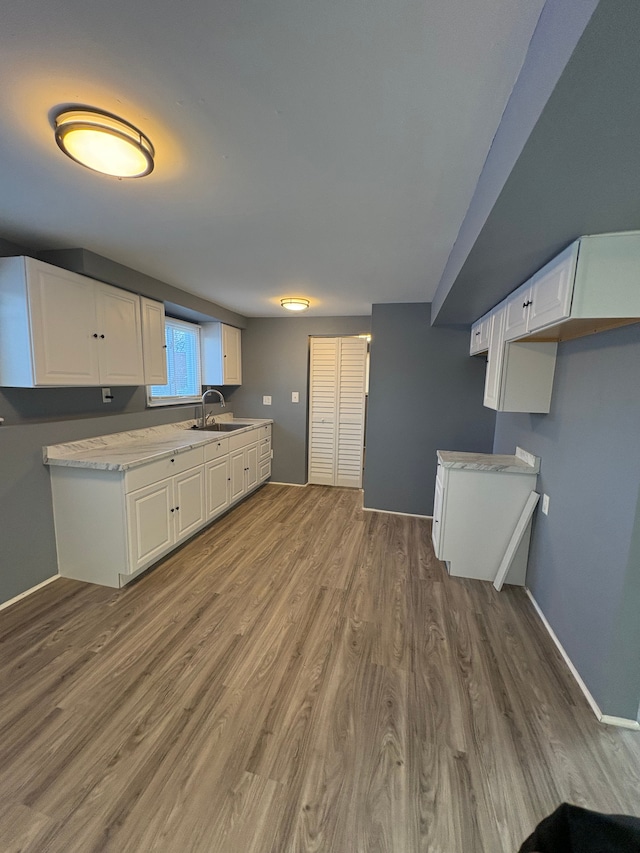 kitchen with white cabinets, dark hardwood / wood-style floors, and sink