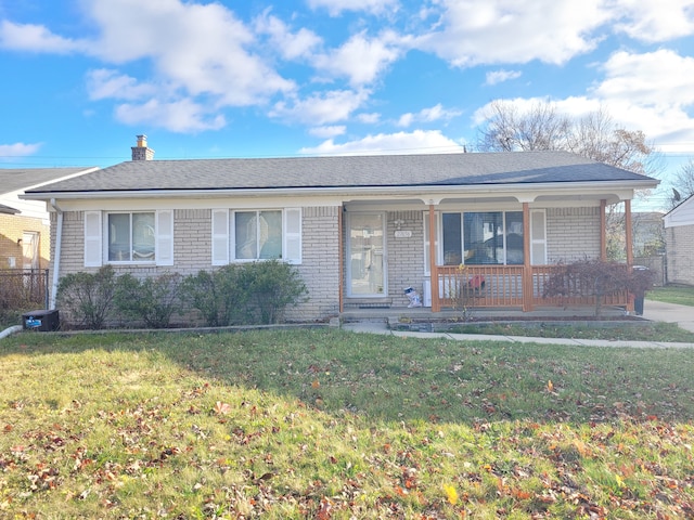 single story home featuring a front yard and a porch