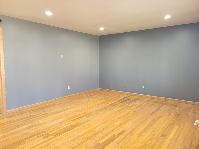 empty room with light wood-type flooring