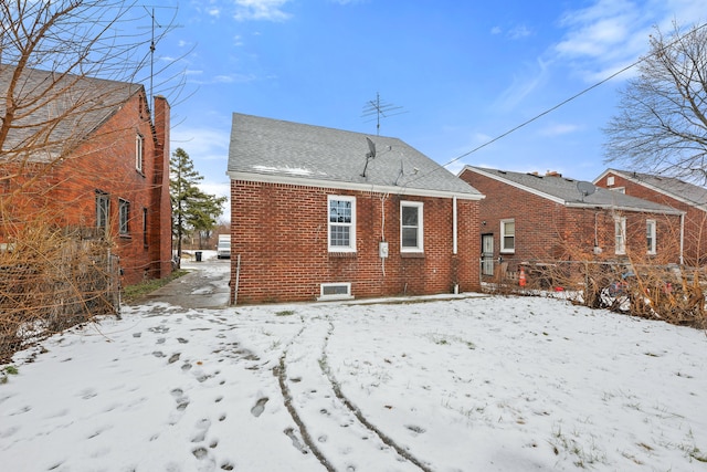 view of snow covered house