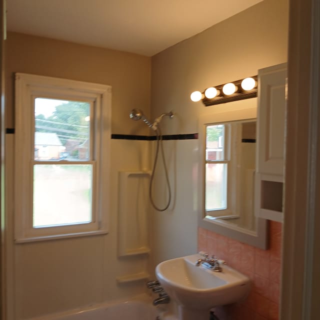 bathroom featuring sink and shower / bathing tub combination