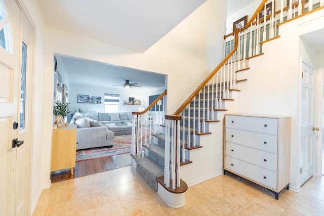 staircase with ceiling fan