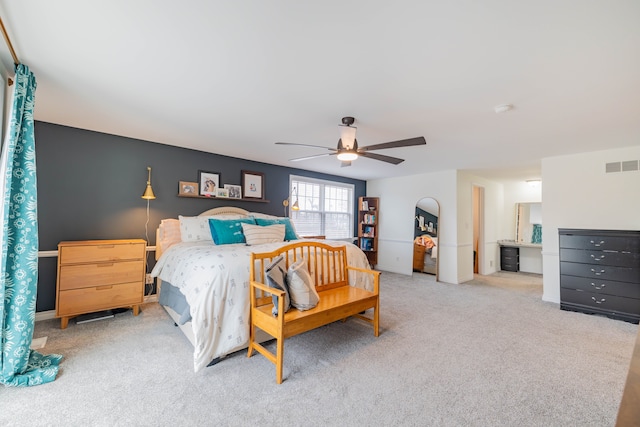 bedroom with ceiling fan and light carpet