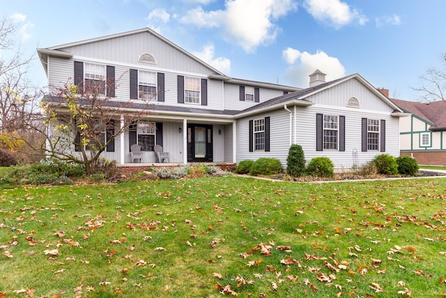 front facade featuring a front yard and a porch