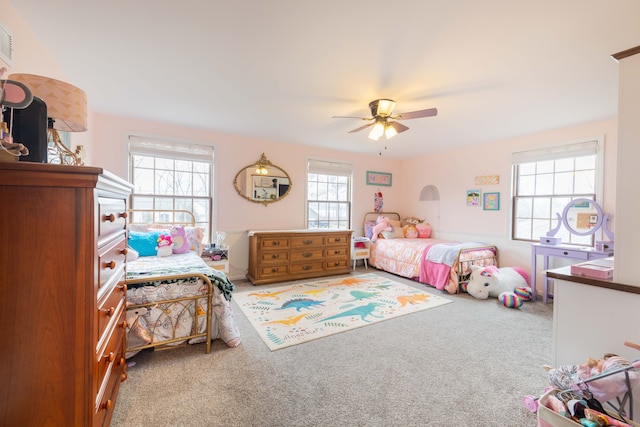 carpeted bedroom with ceiling fan