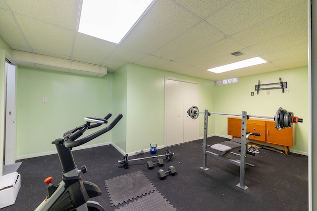 workout area with a drop ceiling