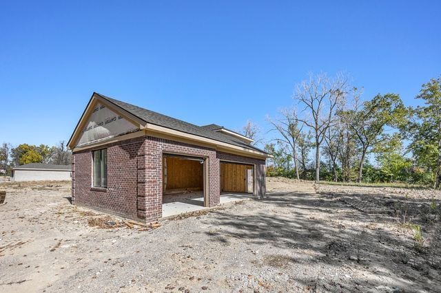 view of property exterior featuring a garage