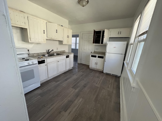 kitchen with sink, white cabinets, dark hardwood / wood-style floors, and white appliances