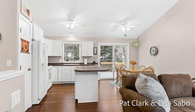 kitchen with ceiling fan, white cabinets, dark wood-type flooring, and white appliances