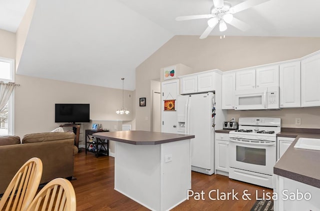 kitchen with white cabinets, white appliances, dark hardwood / wood-style floors, and ceiling fan with notable chandelier