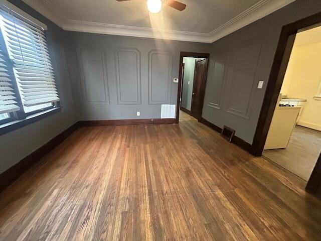 13523 Santa Rosa Dr, Detroit, MI 48238 - empty room with wood finished floors, a ceiling fan, ornamental molding, and baseboards