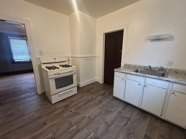 13523 Santa Rosa Dr, Detroit, MI 48238 - kitchen with a sink, gas range gas stove, dark wood-style floors, and white cabinetry