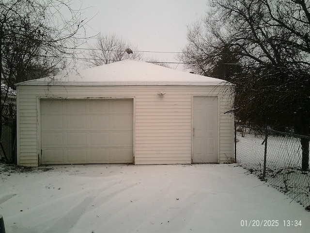 view of snow covered garage