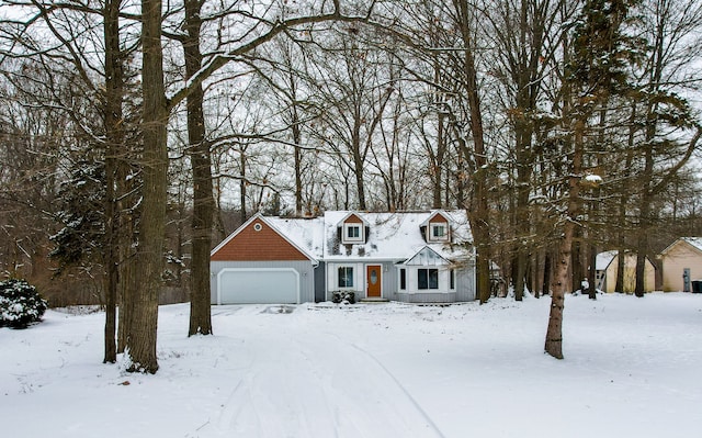 new england style home with a garage