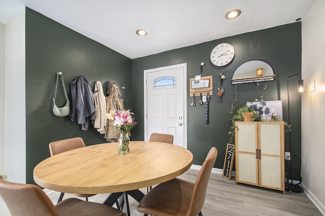 dining room with hardwood / wood-style flooring