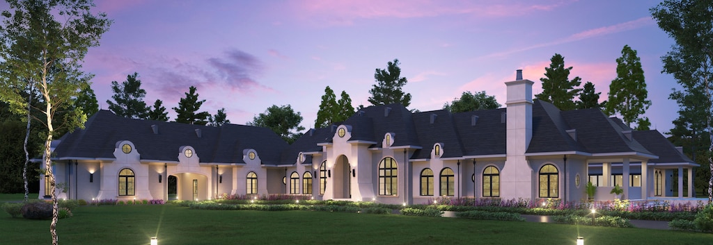 view of front of home with a lawn