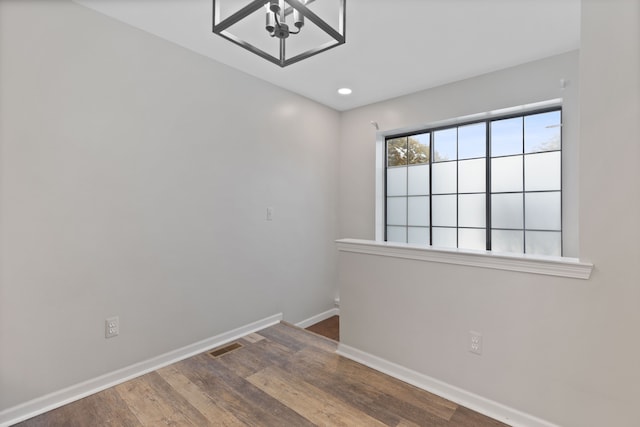 unfurnished room featuring dark hardwood / wood-style floors