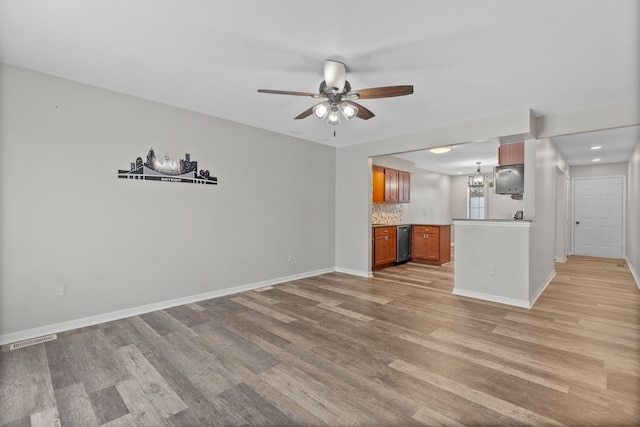 unfurnished living room featuring ceiling fan and light hardwood / wood-style floors