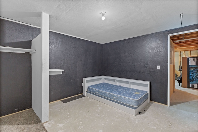 bedroom featuring concrete floors