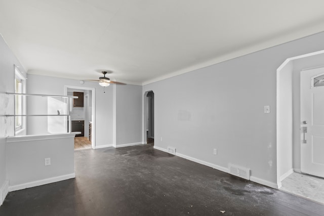 unfurnished living room featuring ceiling fan