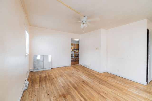 spare room featuring ceiling fan and light hardwood / wood-style floors