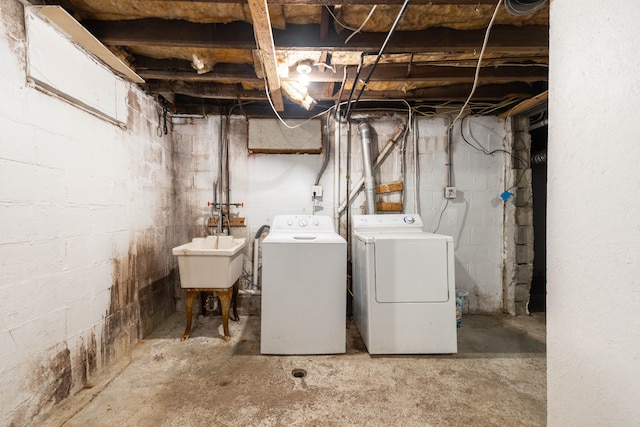 basement with independent washer and dryer and sink