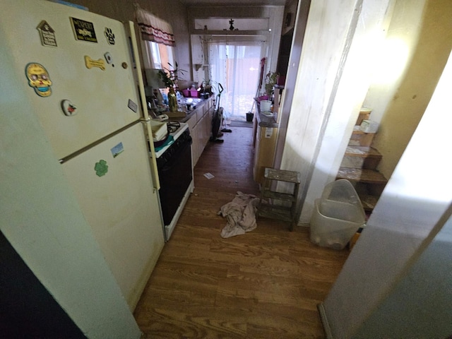 corridor with dark hardwood / wood-style flooring