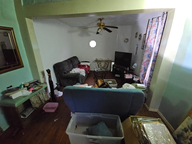 living room with hardwood / wood-style flooring and ceiling fan