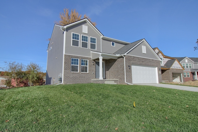 view of property featuring a front yard and a garage