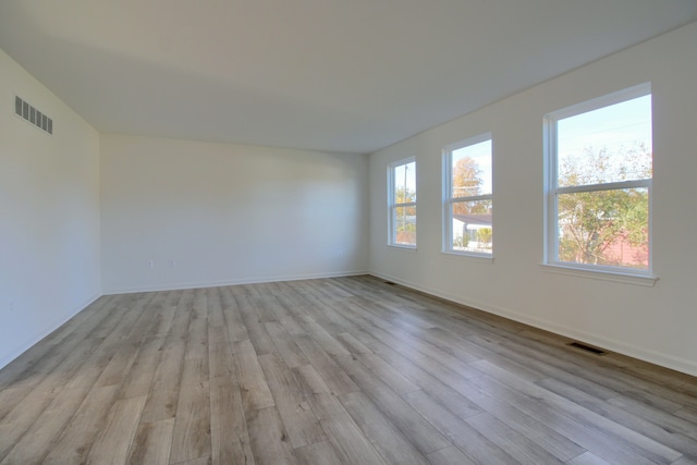 unfurnished room with light hardwood / wood-style floors