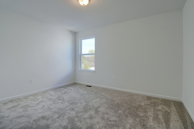 spare room featuring carpet floors