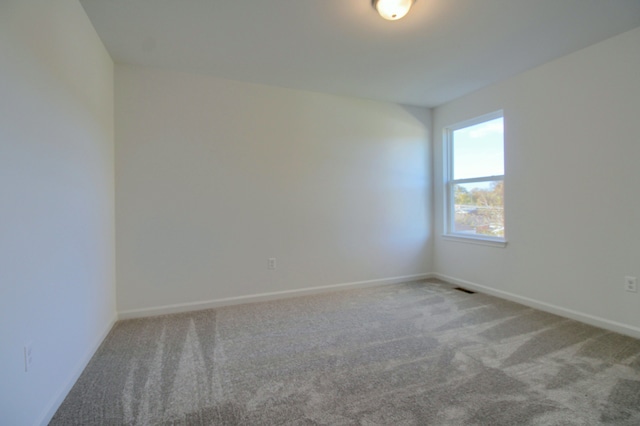 empty room with carpet flooring