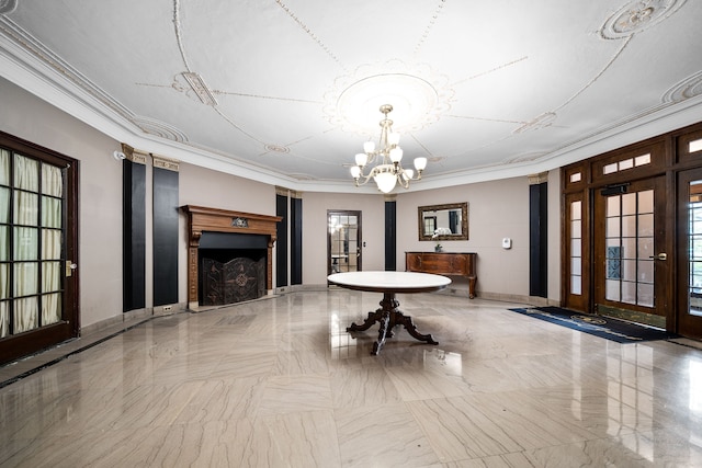 unfurnished dining area featuring crown molding and a chandelier