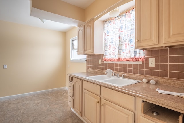 kitchen featuring sink and tasteful backsplash