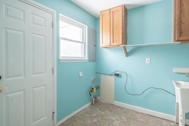 laundry area featuring cabinets