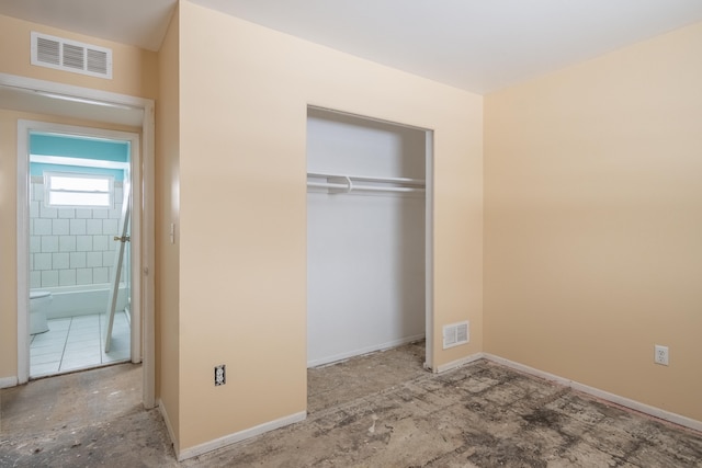 unfurnished bedroom with a closet