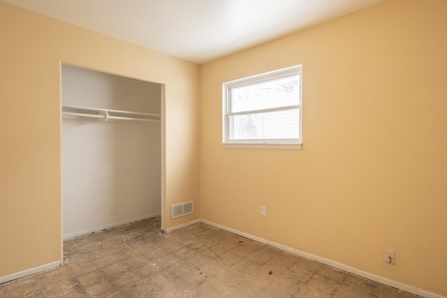 unfurnished bedroom with a closet