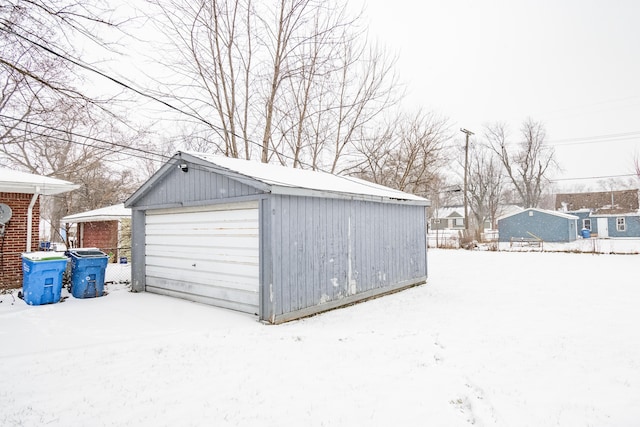 view of snow covered garage