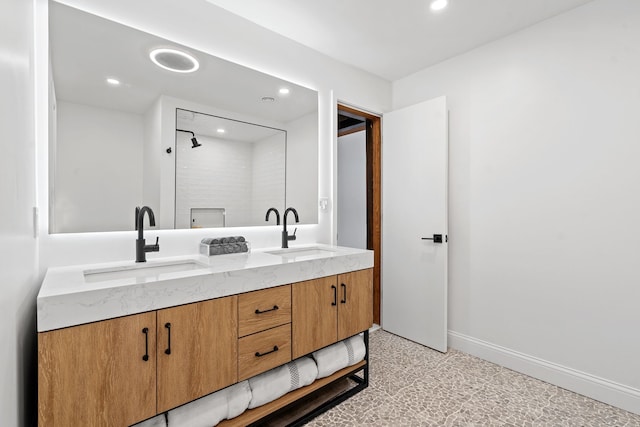 bathroom featuring vanity and a shower