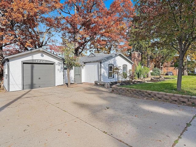 ranch-style home with a front lawn