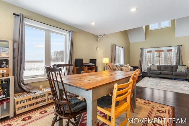 dining space with hardwood / wood-style floors