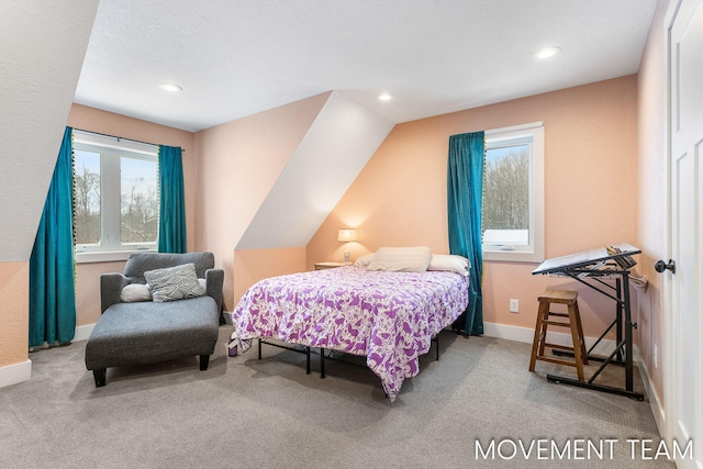 bedroom featuring carpet and lofted ceiling